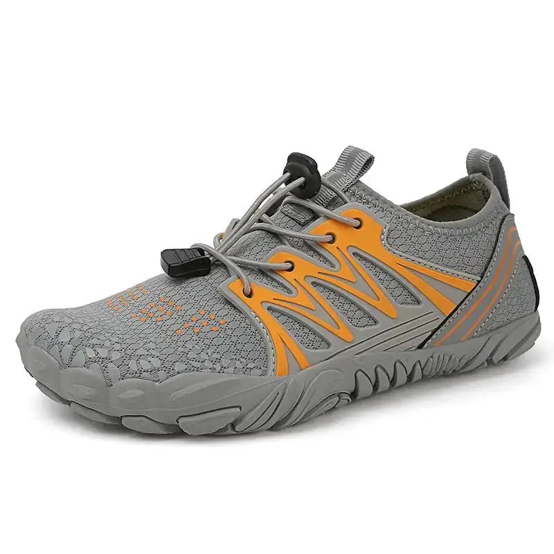 Gray barefoot shoe with orange graphic, lace closure, and flexible cushioned sole