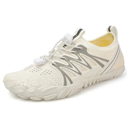 White barefoot shoe with perforated knit upper, elastic collar, and flexible outsole