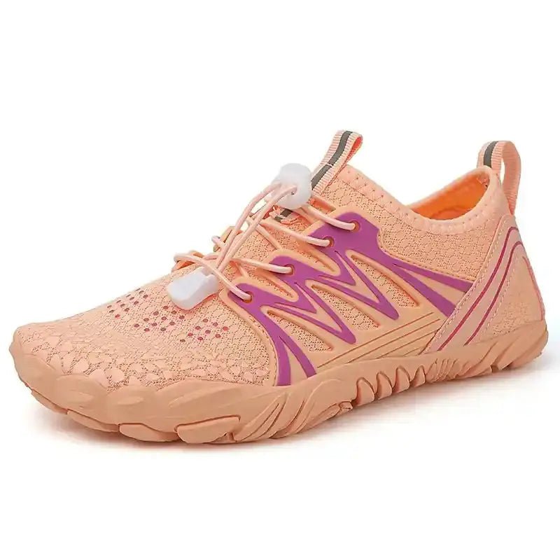 Peach barefoot shoe with perforated knit upper, purple graphic, and flexible sole