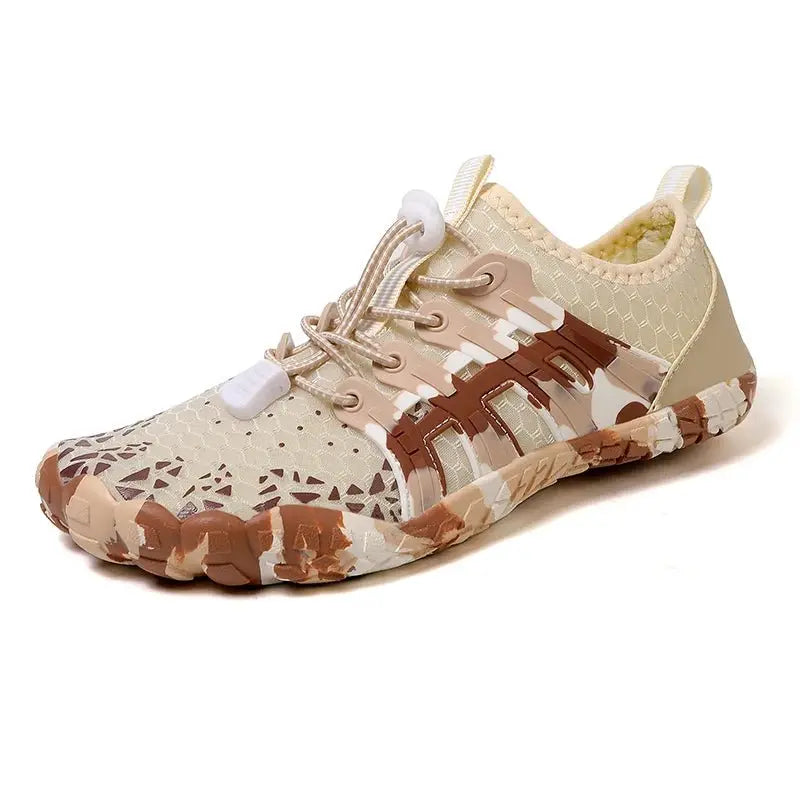 Beige barefoot sneaker with lace-up closure, camo pattern, and grippy tread sole
