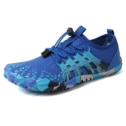 Blue barefoot sneaker with lace-up straps and textured grip sole with bold panels
