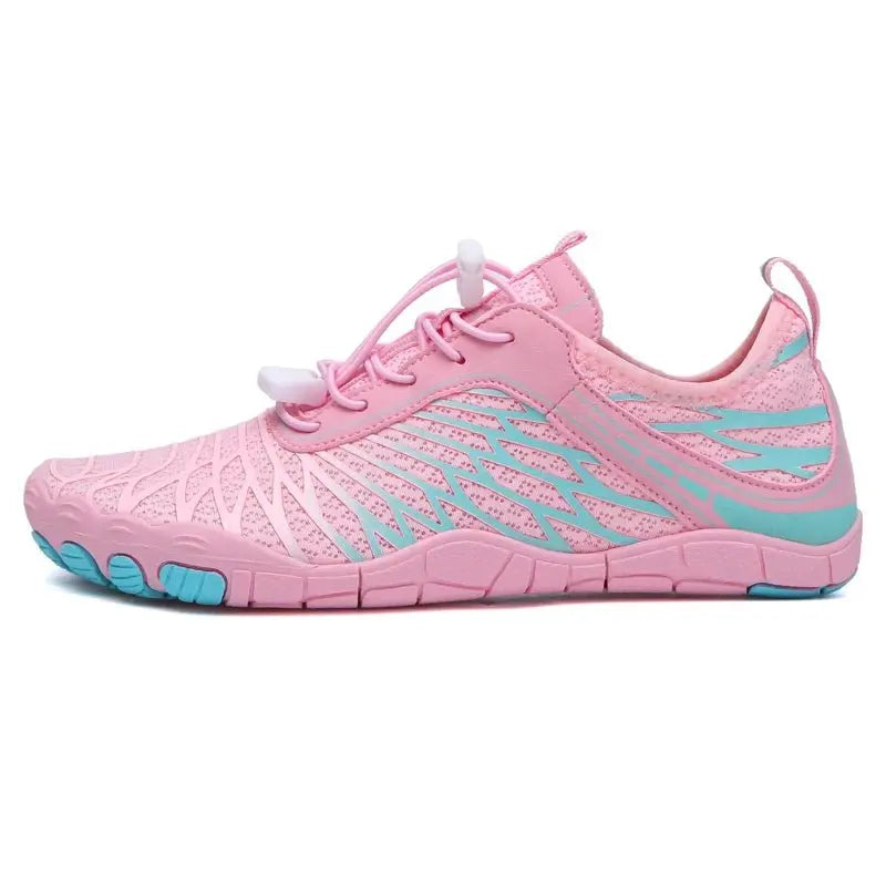 Pink mesh barefoot running shoe with lace-up closure and cushioned traction sole.