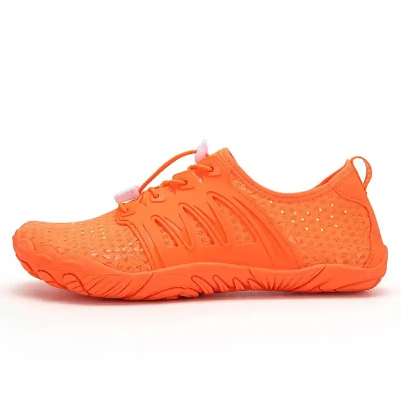 Orange barefoot shoe with lace-up knit upper and textured rubber traction sole.