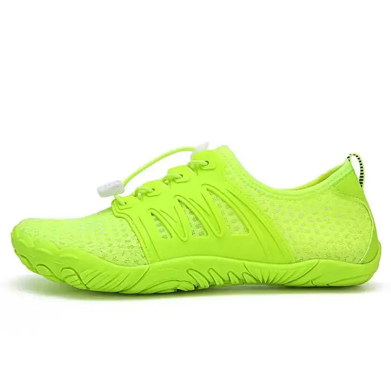 Neon green barefoot shoe with lace-up knit upper and textured grip outsole.