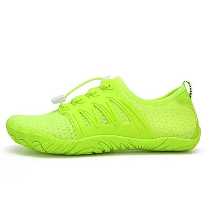 Neon green barefoot shoe with lace-up knit upper and textured grip outsole.