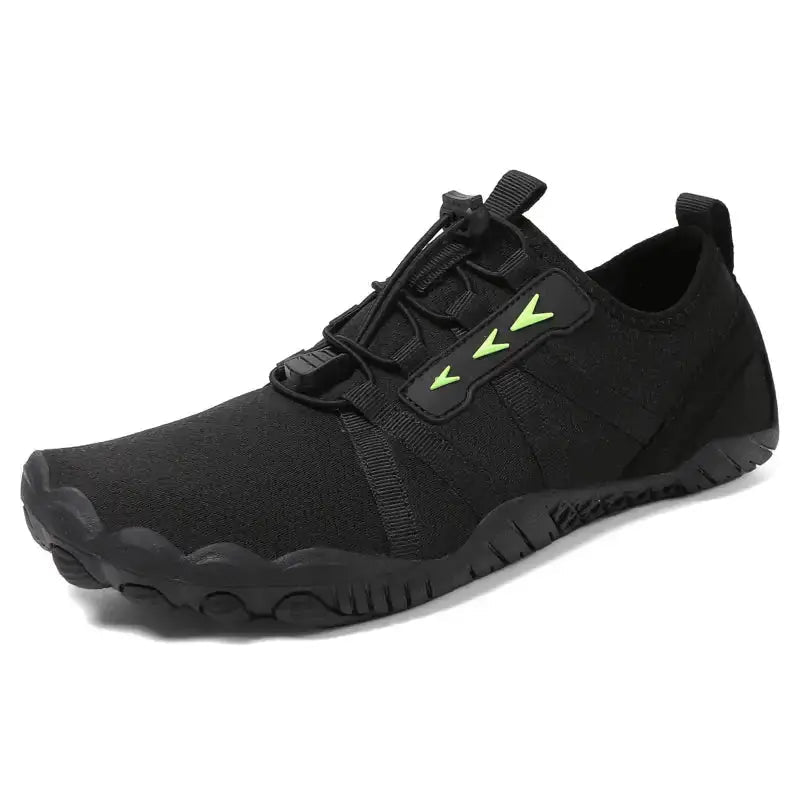 Unisex black barefoot shoe with lace-up straps and neon green accents