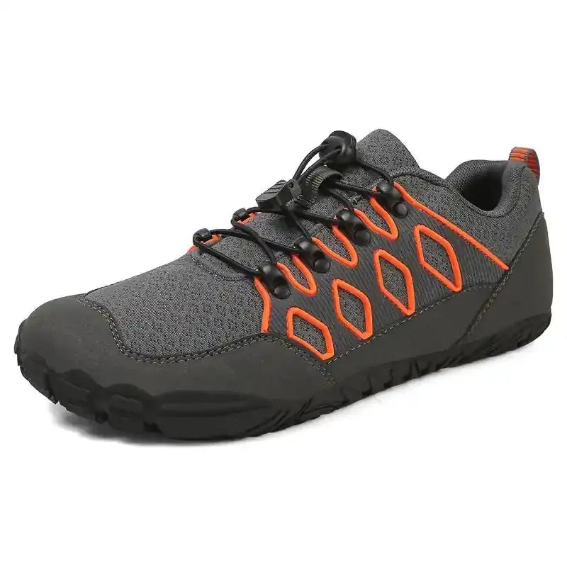 Gray barefoot shoe with orange lace accents and black rubber tread sole