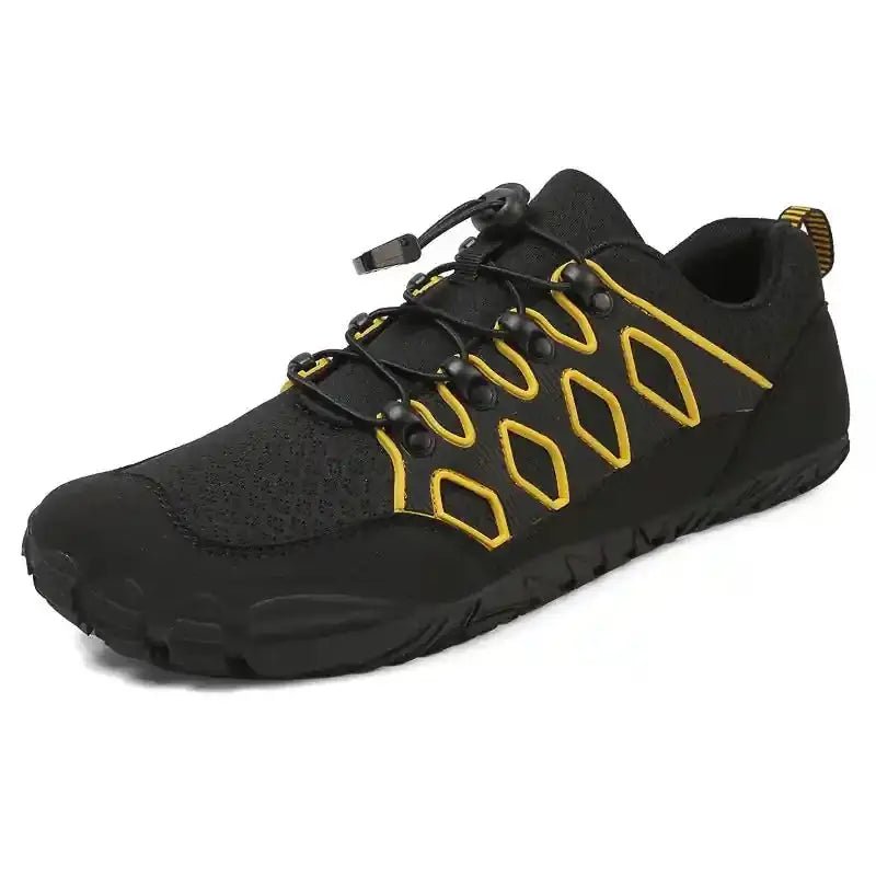 Black barefoot shoe with yellow-orange lace accents and textured rubber sole