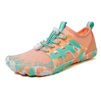 Peach and coral barefoot sneaker with lace-up closure, teal accents, and grip sole