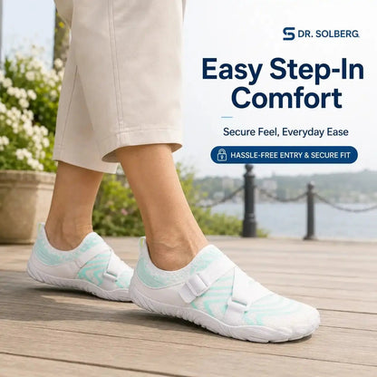 Light blue slip-on barefoot shoe with white strap and lightweight grippy sole