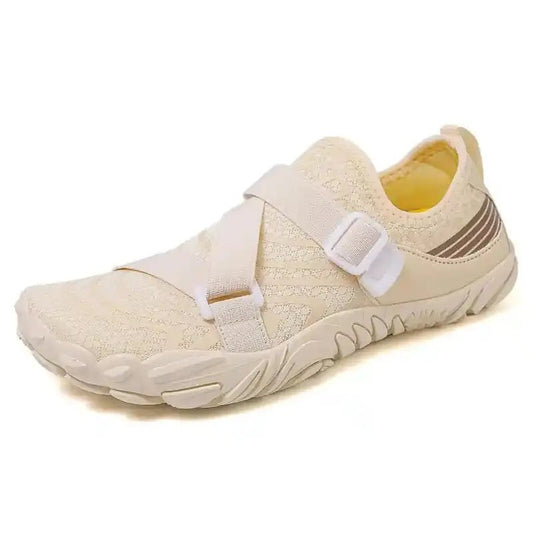Cream slip-on barefoot shoe with adjustable strap and flexible tread sole